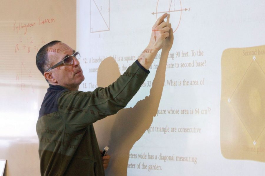 Math teacher Eric Brody lectures his third period Geometry A class, which will no longer be offered next year.