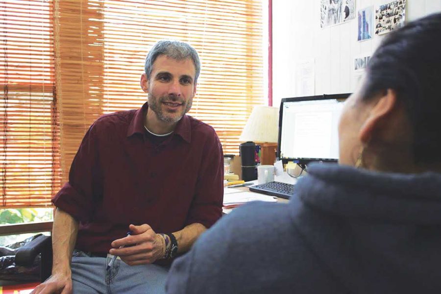 Martin Steinman consults with a client at Canal Alliance. Aside from teaching English to Spanish-speaking immigrants, he assists with matters ranging from tax return preparation and filing to guidance on issues of domestic abuse. In the past, Steinman also taught Social Studies at Redwood for a brief period of time.