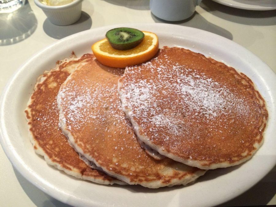Dusted with powdered sugar, the $7.25 buttermilk pancakes at the Half Day Cafe, served with a side of fresh fruit, failed to tantalize my taste buds. 
