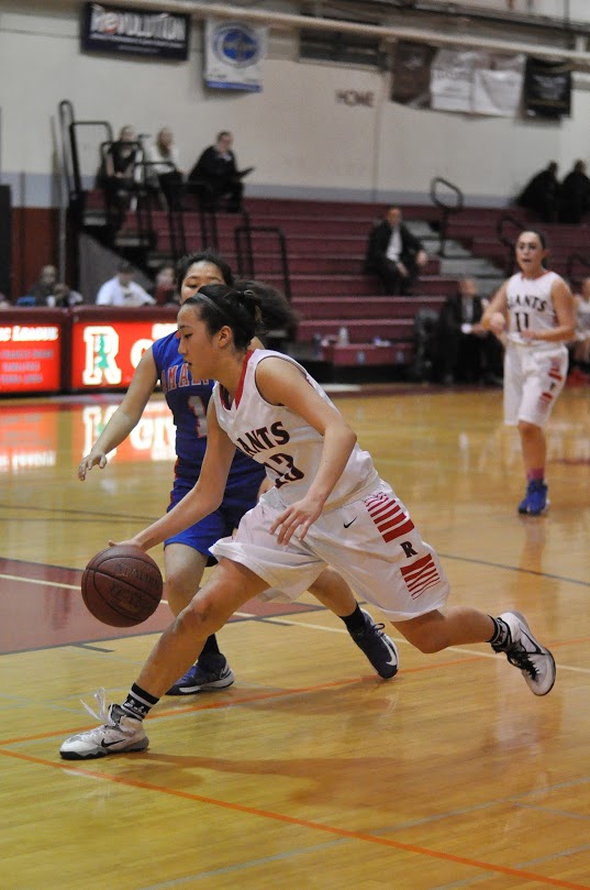 Sophomore Nicki Yang dribbles toward the basket in the close game against rival Tam on Tuesday, Jan. 22.
