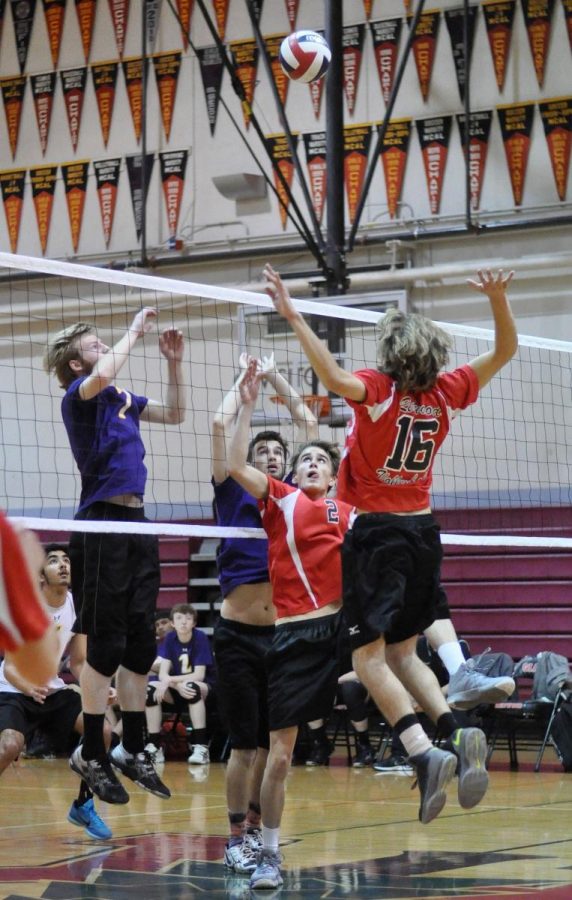 JUNIOR IVAN ALIKHANOV jumps up to spike the ball in a game against Kennedy High school. 