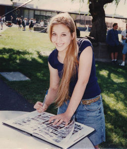 Allison Kristal, a 1998 graduate, signs a yearbook on the South Lawn.