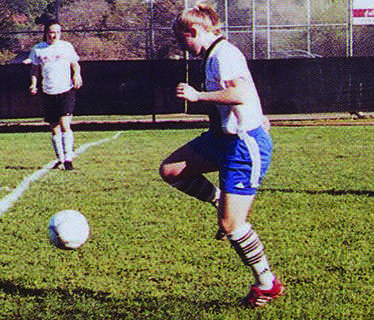 Amy Mastromonaco, a 2005 alumus and four year varsity soccer player, dribbles a soccer ball.