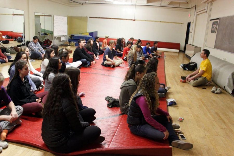 English teacher Alex Franklin leads a meditation session in the multi-purpose room for ELE week.