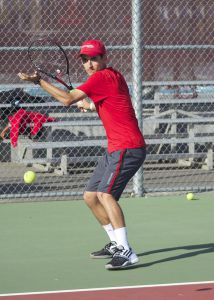 Junior Mitchel Heckmann hits the ball to a teammate during practice.