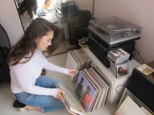 Sophomore Tara Antee sorts through her extensive collection of vinyl records