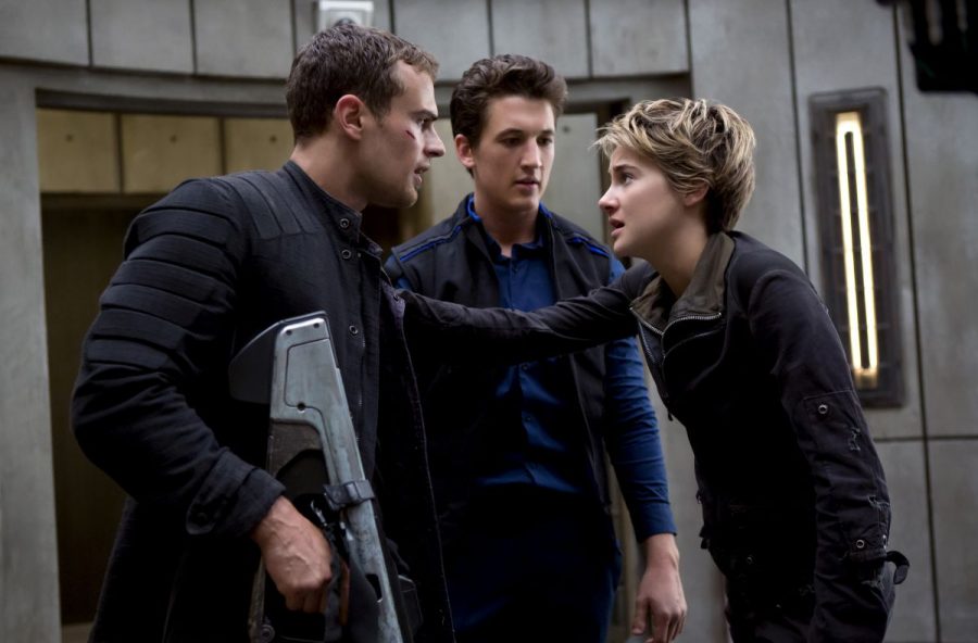 Tris Prior, portrayed by Shailene Woodley, (right) and her boyfriend Tobias Eaton (Theo James, left) debate their attack plan with Peter Hayes (Miles Teller), Insurgent premiered on March 20 and is expected on DVD in August.