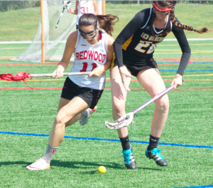 Junior Jenny Green competes for a ground ball.