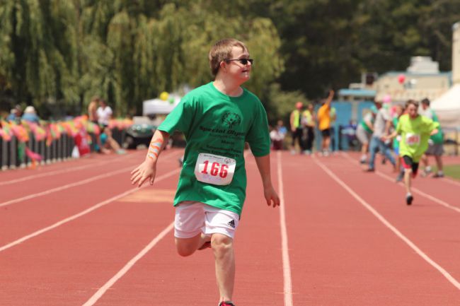 Running in a track meet, Griffin Herz, brother of senior Alex and sophomore Jenna, doesn't allow his Down Syndrome to affect his day-to-day life.