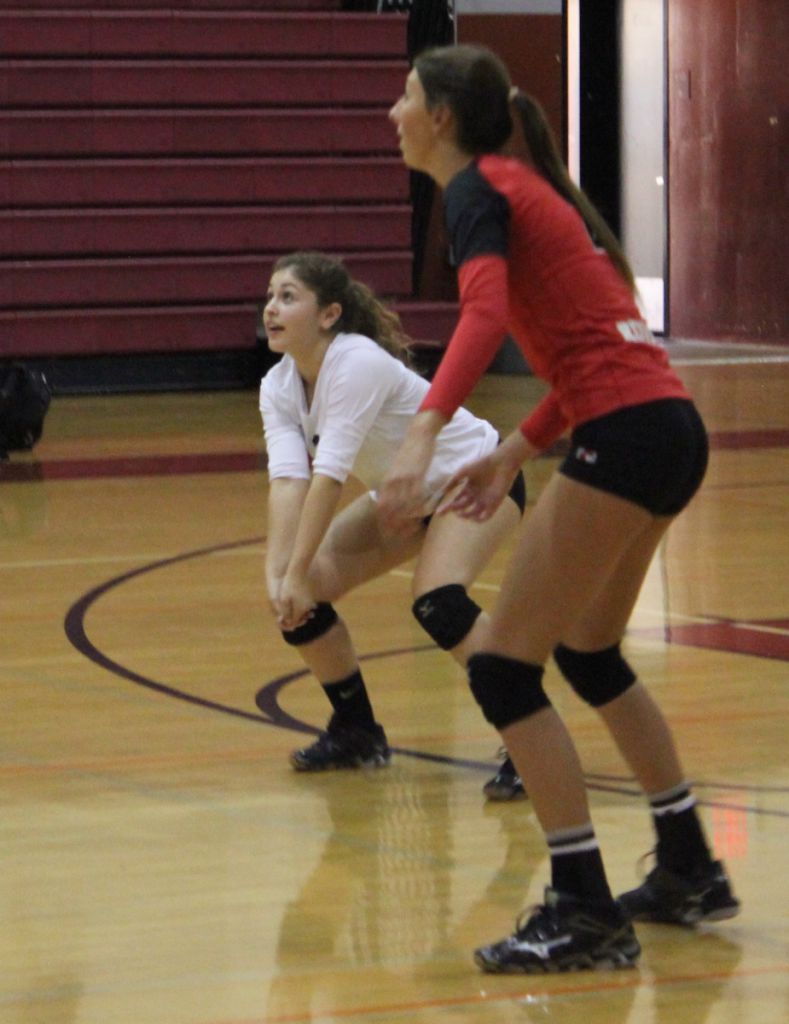 Sophomores Raya Corren and Alex Lefebure prepare to set the ball to a teammate.