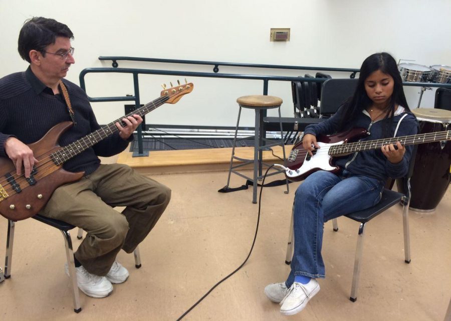 Miranda Overson practices bass with a professional instructor,
