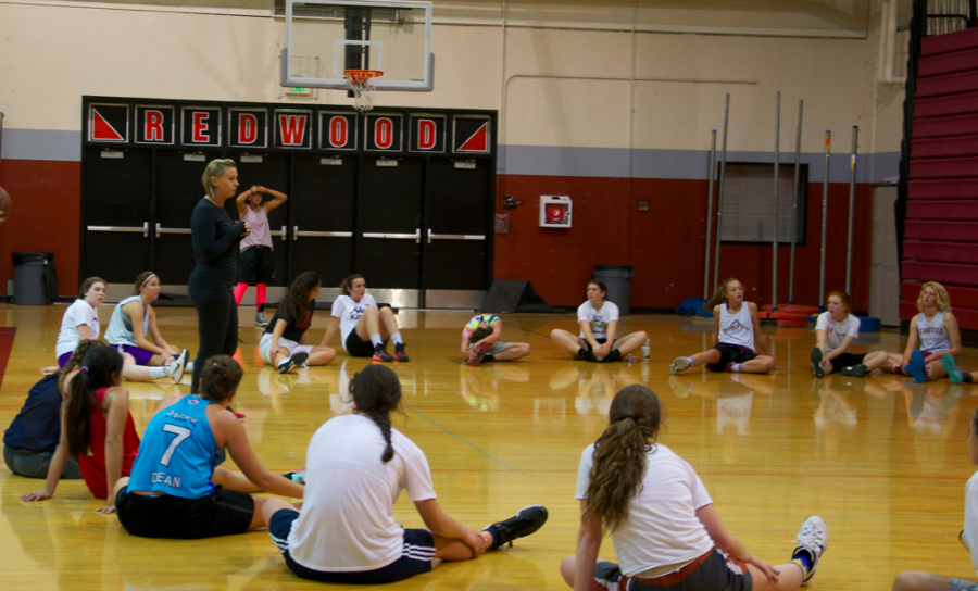 Coach Diane Peterson talks to members after the first night of tryouts. 