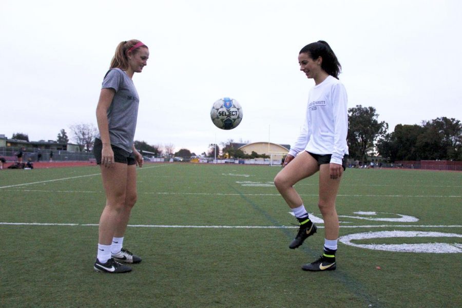 Lauren Foehr and Hannah Halford juggle the ball after their practice