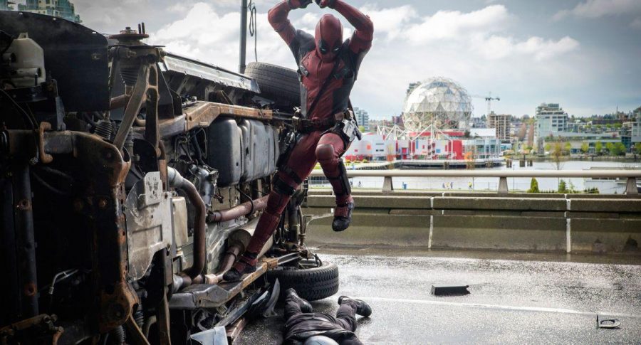 Deadpool attacks his enemies after a car chase.
