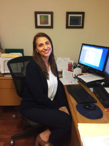LUCIA MARTEL-DOW, el director de inmigracion servicios legales de la Alianza de Canal, posa para una foto en su escritorio.