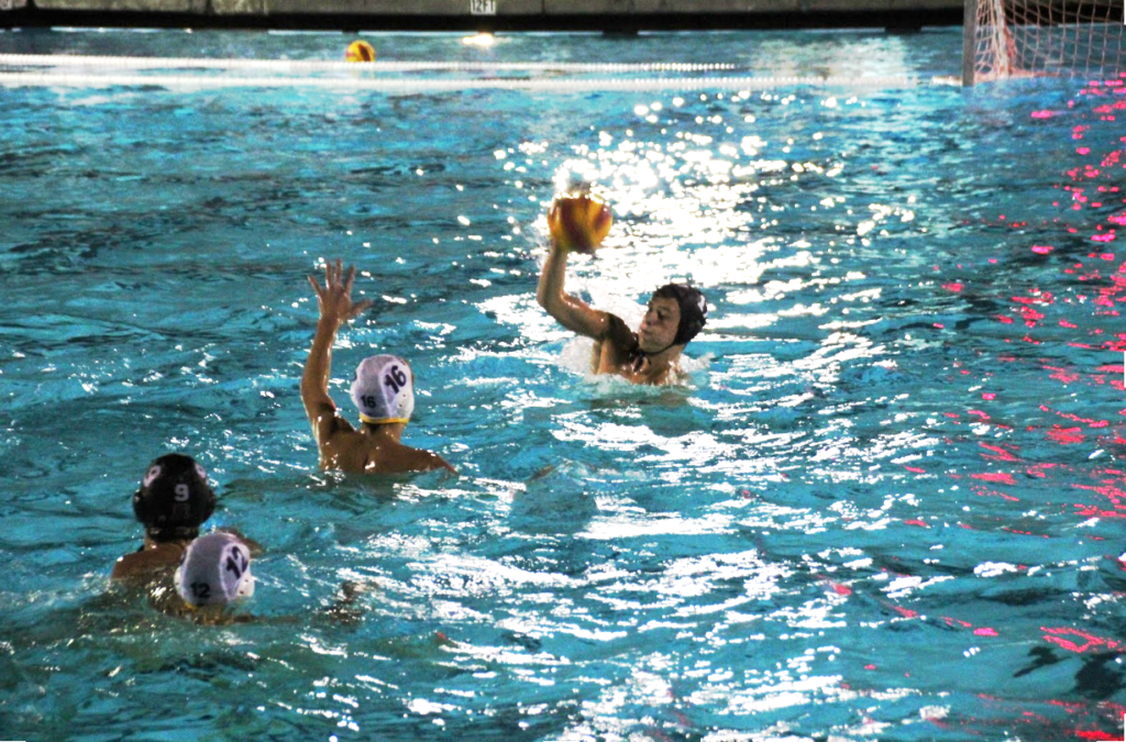 #12 Ryan Schoenlein takes a shot on goal during the 2nd half of the Redwood varsity water polo game against Ukiah. 