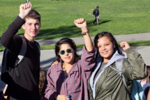 Raising their fists in solidarity with those offended by President-elect Donald Trump's campaign, students attended the Monday protest.
