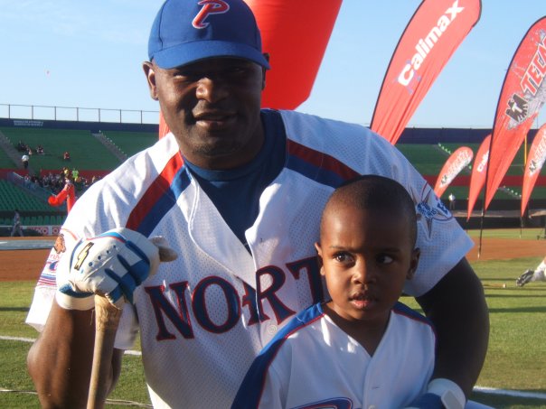 Posing with his father, DJ White sees his father as a role model and a mentor, though he no longer plays baseball. 