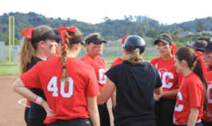 The team regroups. Junior Cami Klemme wears a small "GC" on the ribbon in her hair to honor the late coach Gary Casassa. 