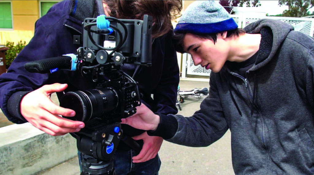 Garet Jatsek adjusts a camera during the production of a Redwood TV episode.