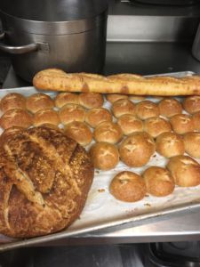 Freshly baked bread cooling off in the kitchen of Rhoda Goldman Plaza