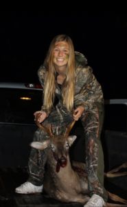 Sophomore Delaney Anderson holds up a recent kill. Her family either consumes or donates all of the meat they hunt. 