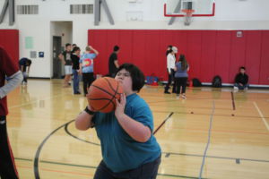 Aiming for the hoop, a player shoots the ball