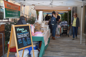 Farmers market runs through Corte Madera, town center mall selling fresh fruits and vegetables. 
