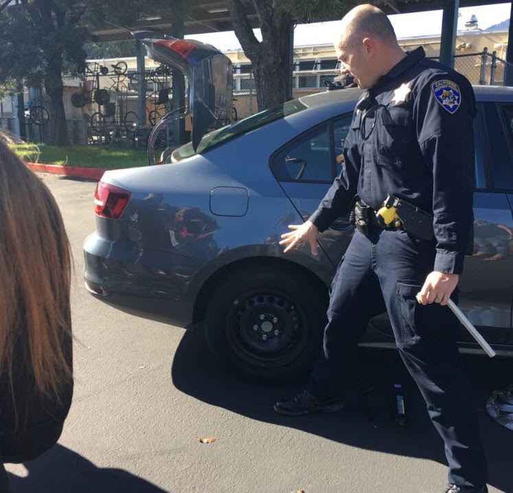 CHP officer comes to school to show the club how to change a tire. (Courtesy of Natalie Veto)