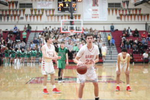 Standing at the line, junior Brandon Radu gets ready to shoot two free-throws.