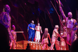 Mid musical number, Aladdin (right) as played by Adam Jacobs and Genie (left) played by James Monroe Iglehart sing passionately. 