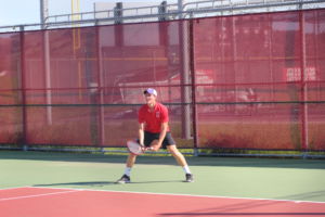 Junior Stevie Gould prepares for his opponents serve