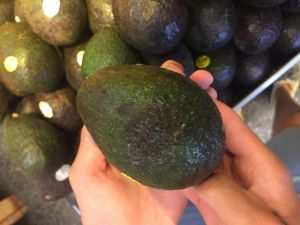 An avocado with black spotting