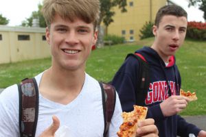 Senior Zach Tull  enjoys a slice of Stefano's pizza at lunch on campus during Sustainability Week.