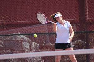 Junior Vanessa Comins attacks a forehand during drills
