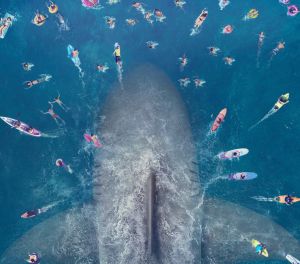 The giant prehistoric shark makes its move on a group of swimmers.