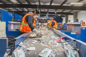 Workers at Marin Sanitary Service work hard to sort all the recycled material that passes through their building.