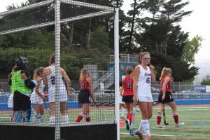 After scoring another goal for the Giants, players Camille Ray (3), Caroline Soja (10) and Nicole Notter (18) walk away from Hawks territory 