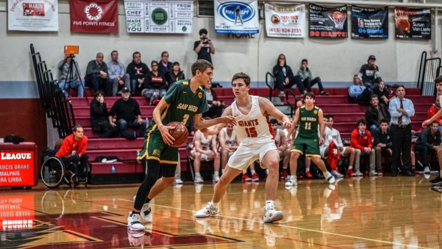 Redwood varsity boys’ basketball team manages to seize intense win with weak defense