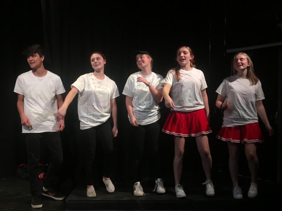 Students sing in a musical number in their One Act.