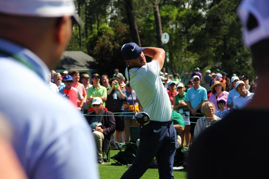 Brooks Koepka tees off of the first hole at The Masters.