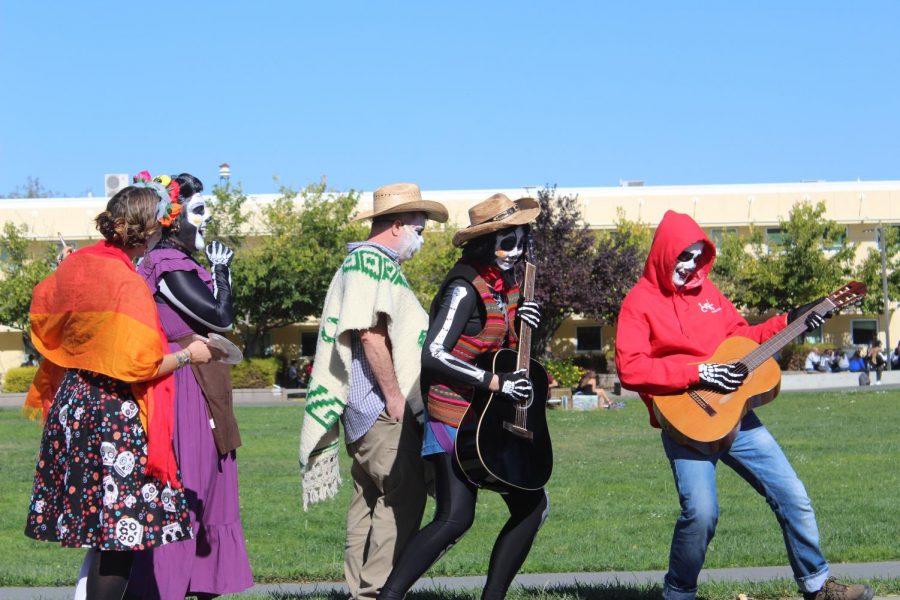 Dancing across the stage for the costume contest, the Spanish department poses as characters from Coco.