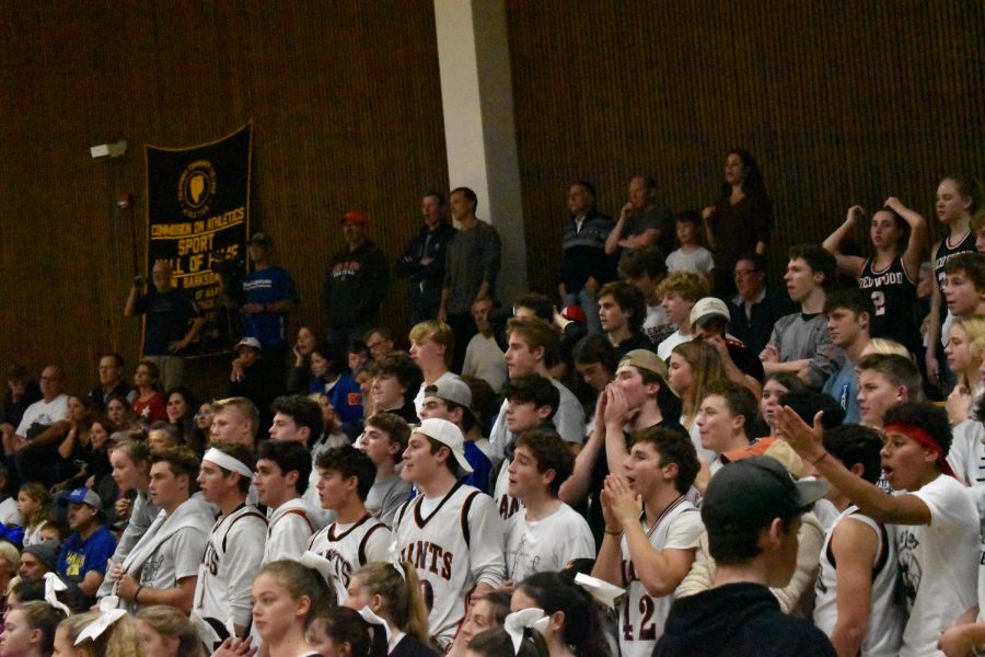 Despite the boys varsity basketball 48-26 loss to Branson, Redwood students continued to cheer loudly for their peers at the white-out themed game. 
