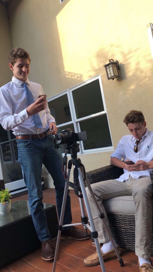 Creating a new video, Matt Shippey and Callaway Allen look over their scripts. 