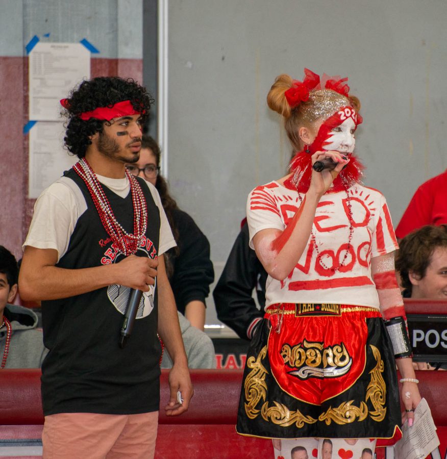 Seniors and rally MCs Whitney Johnson and Yahya Alzerjawi hype up the crowd.