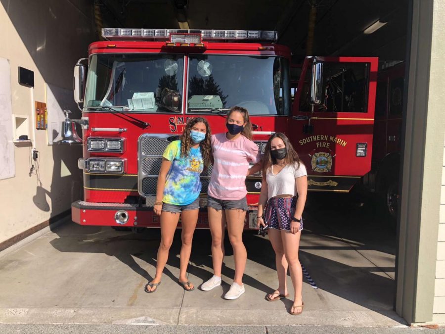 Zirpoli, Ryning and Rothbart gather at the fire station after delivering their first round of cookies