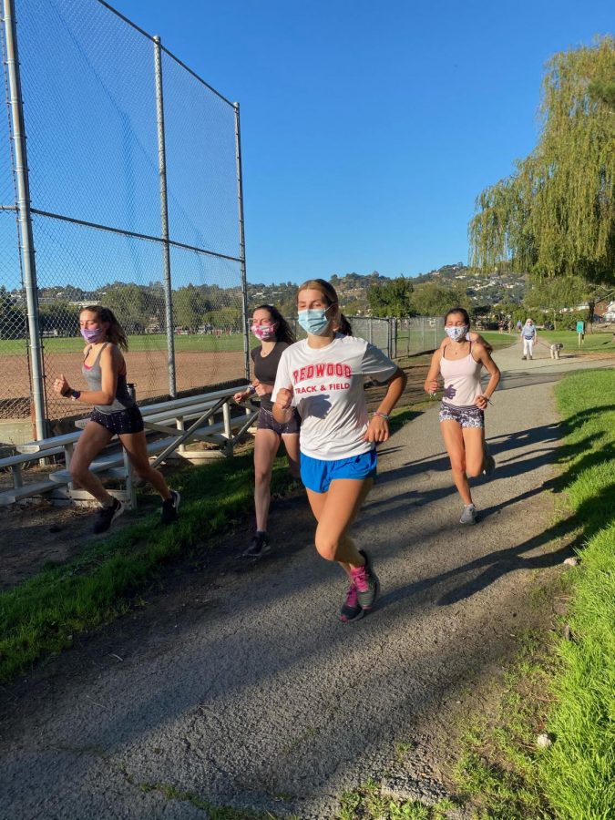 Runners on the cross country team wear their masks while training. (Photo courtesy of Keely Ganong)