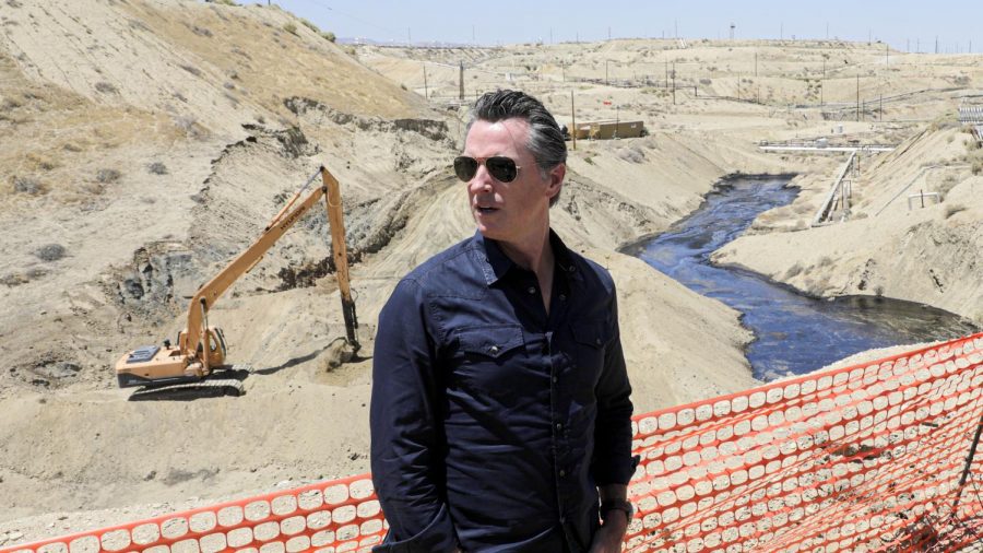 Gov. Gavin Newsom visits a creek in McKittrick, California, where more than 800,000 gallons of oil has been spilled.