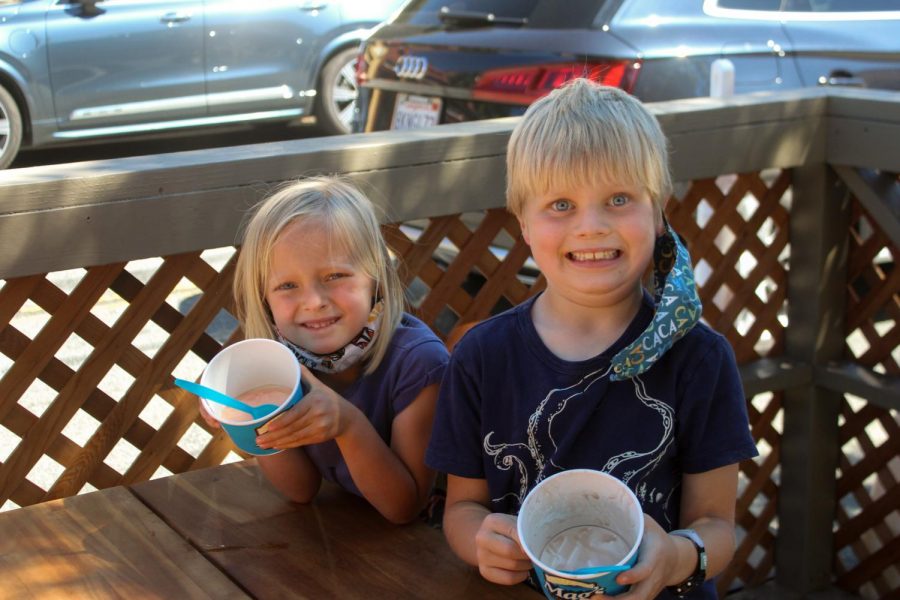 Smiling with their empty bowls, these siblings can’t seem to wipe the smiles off their faces.