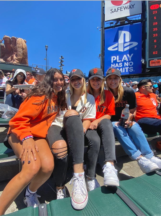 Smiling for the camera on a bright, sunny day at Oracle Park, seniors Sophia Pero, Greer Diaz,  and Lauren and Claire McKechnie (from left to right) support the San Francisco Giants. Photo courtesy of Greer Diaz.
